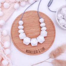 Load image into Gallery viewer, Necklace with white beads on a wooden board labeled 'Mama Bear & Cubs' with decorative elements.